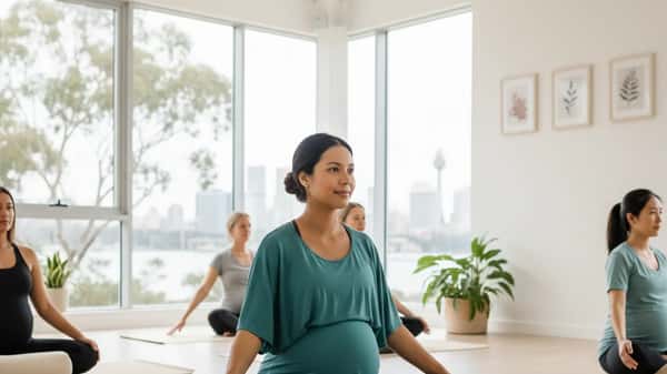 Pregnant Australian woman in Butterfly Pose on a yoga mat at a Sydney prenatal yoga studio