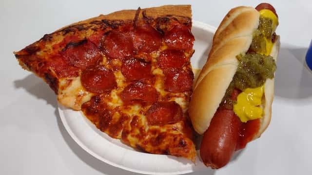 Costco food court pizza slice and hot dog combo on food court tray