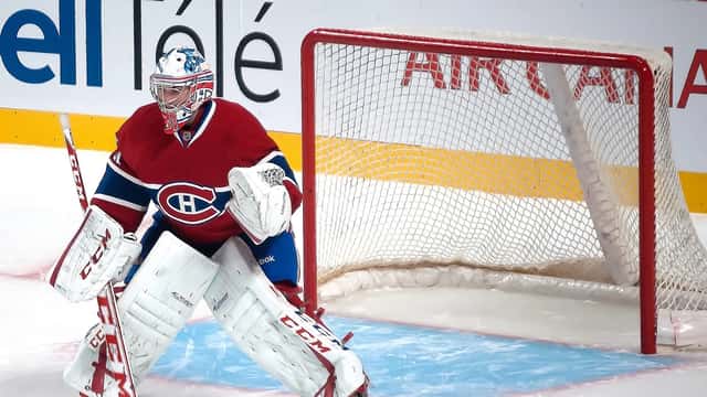 Carey Price in Montreal Canadiens uniform making a save, documentary press photo style