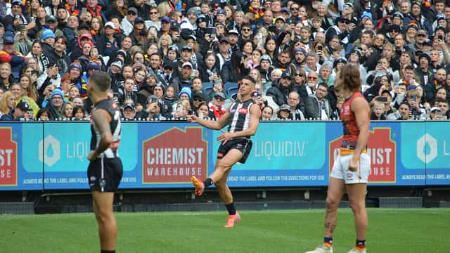 Scott Pendlebury in action for Collingwood, representing AFL athlete wealth management and investment risk