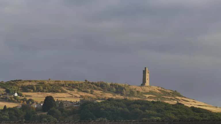 Huddersfield town centre with Castle Hill in the background, West Yorkshire