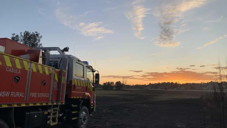 Bushfire aftermath in NSW showing scorched landscape and damaged property, 2026