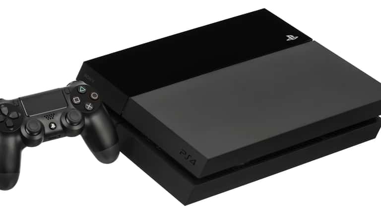 PlayStation 4 console and controller against white background