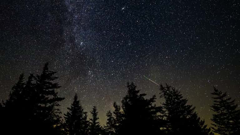 Meteor streaking across a dark night sky, photographed by NASA