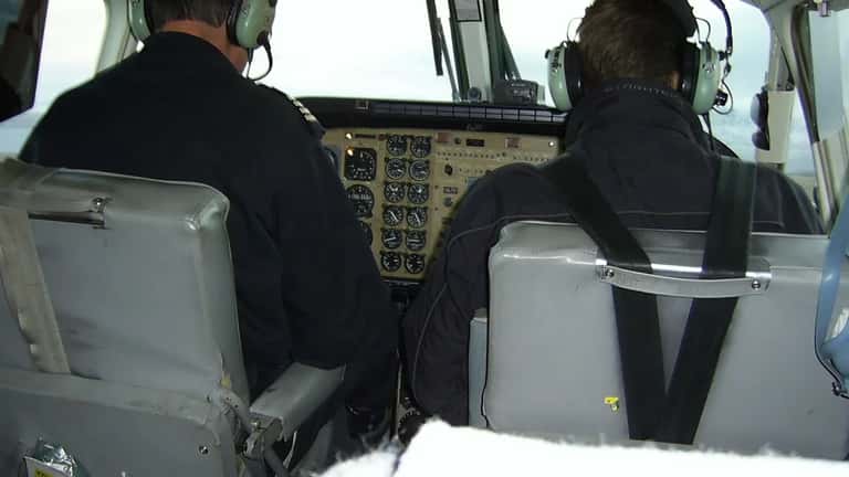 Cockpit of Kenn Borek Air Canadian aircraft showing pilot navigation instruments