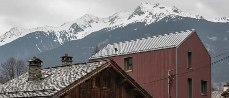Typical Icelandic corrugated-iron house with an electrician van parked outside on a Reykjavík suburban street