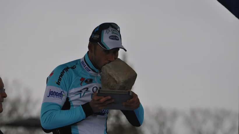Professional cyclist Tom Boonen racing on cobblestones at Paris-Roubaix 2012