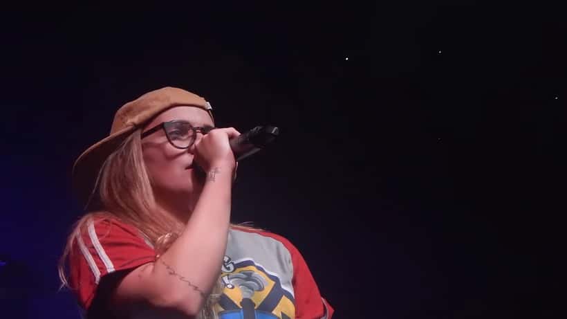 G Flip performing live on stage at a concert festival