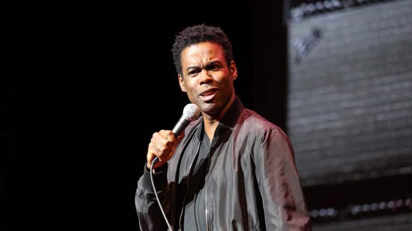 Chris Rock performing on stage during his comedy tour, 2026