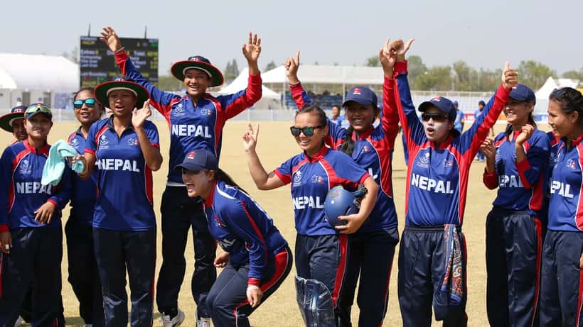 Japan women's cricket players at an Asian Games match, competing on the field during international tournament play