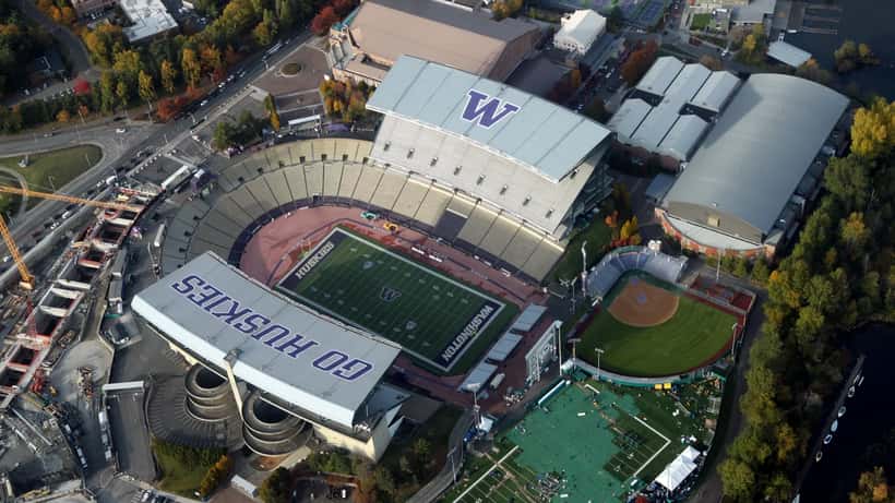 Aerial view of Husky Stadium in Seattle packed with fans during a college football game