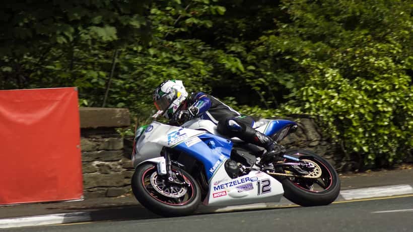 Dean Harrison racing at the Isle of Man TT on his motorcycle
