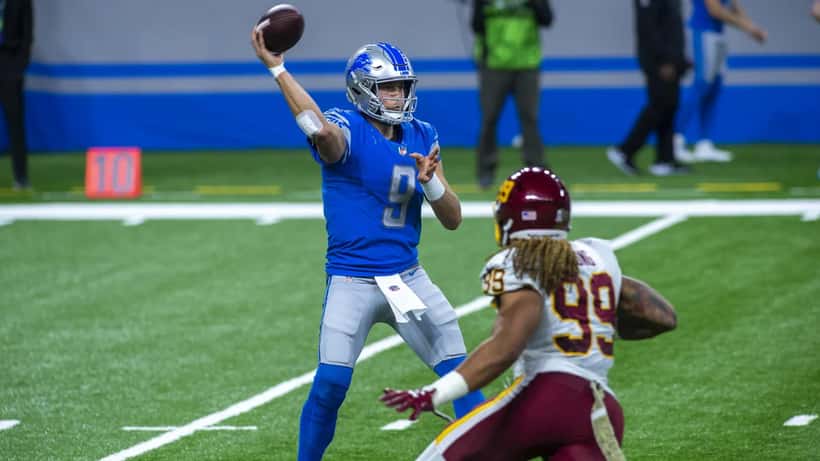 Matthew Stafford in game action on NFL field representing peak career earnings decision