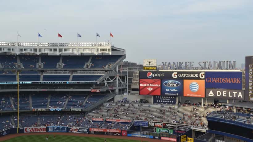 New York Yankees baseball players in action at Yankee Stadium during an MLB game