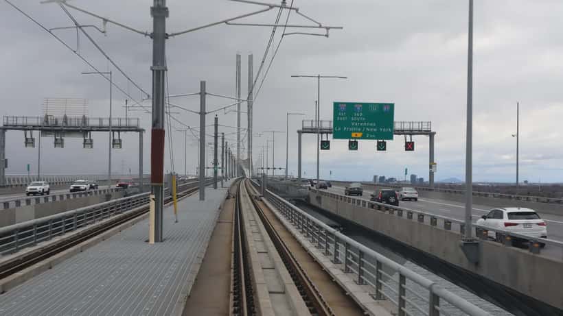 REM automated light rail train crossing the Champlain Bridge in Montreal