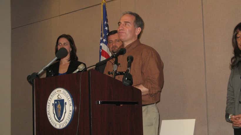 Consumer victim speaking at a Massachusetts Attorney General consumer protection event