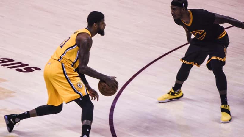 Paul George NBA basketball player in action on court