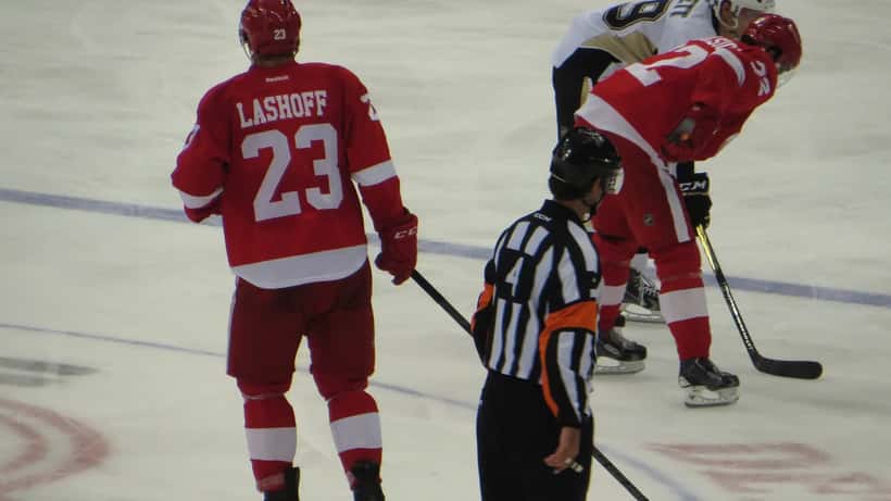 NHL defenseman in game action illustrating professional athlete contract rights discussion