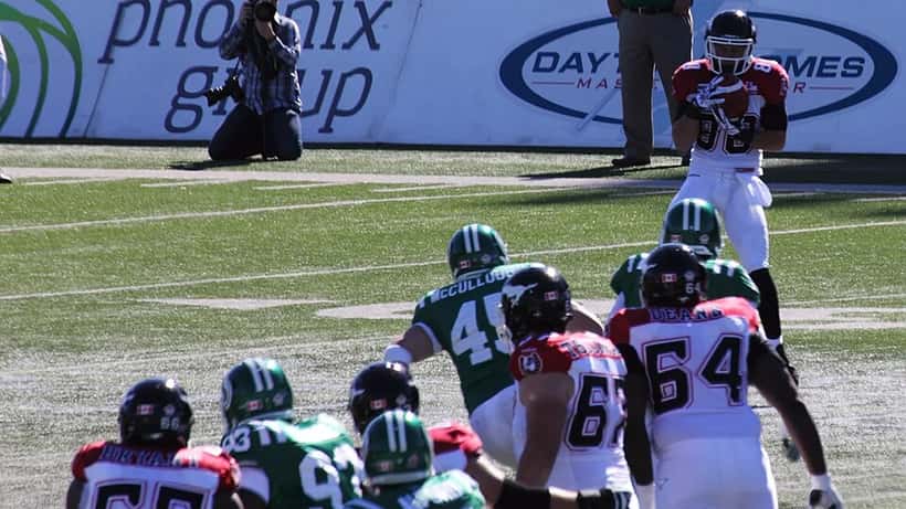 CFL game between Saskatchewan Roughriders and Calgary Stampeders, historic football rivalry Canada