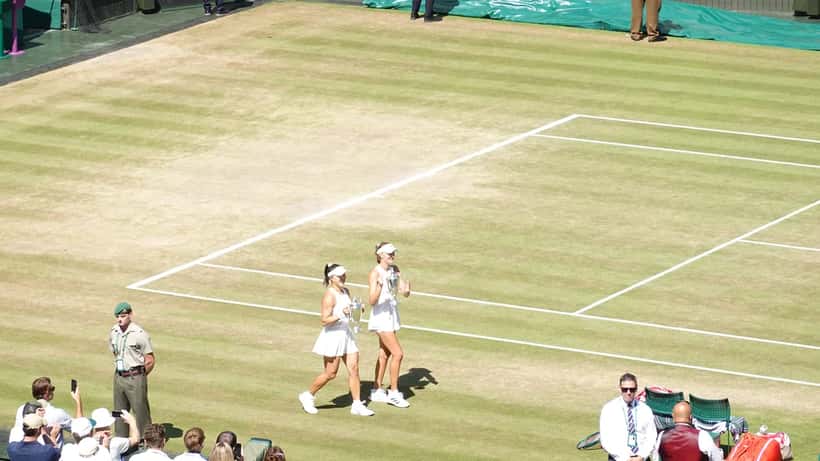 Guo Hanyu and Kristina Mladenovic playing doubles at Wimbledon 2026