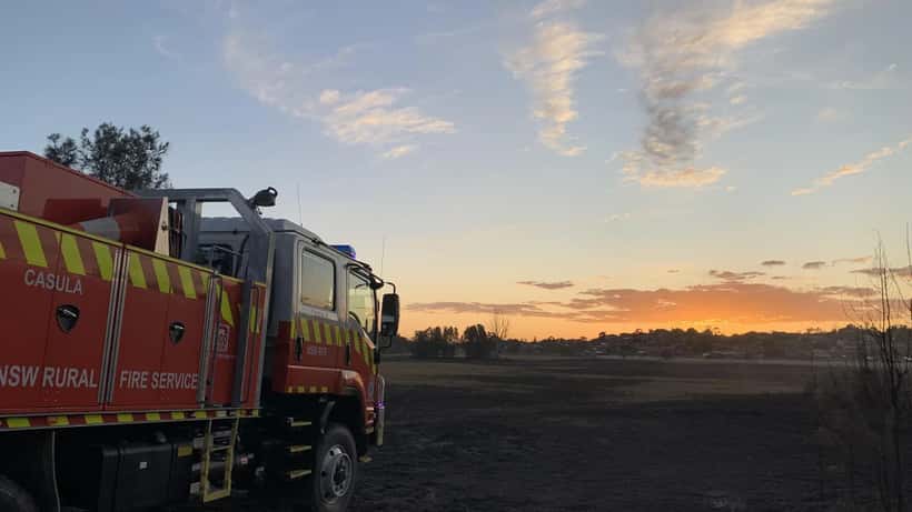 Bushfire aftermath in NSW showing scorched landscape and damaged property, 2026