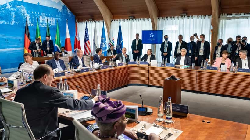 G7 world leaders meeting at summit table, international diplomacy and economic agreements