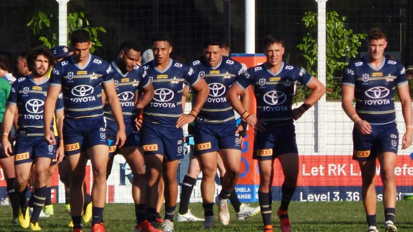 North Queensland Cowboys NRL players in action during a match at a Queensland stadium