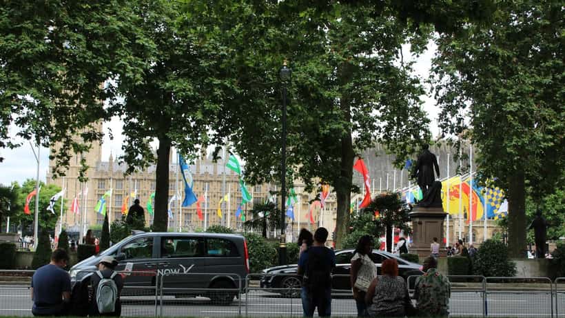 UK flags and the Supreme Court building in Parliament Square London