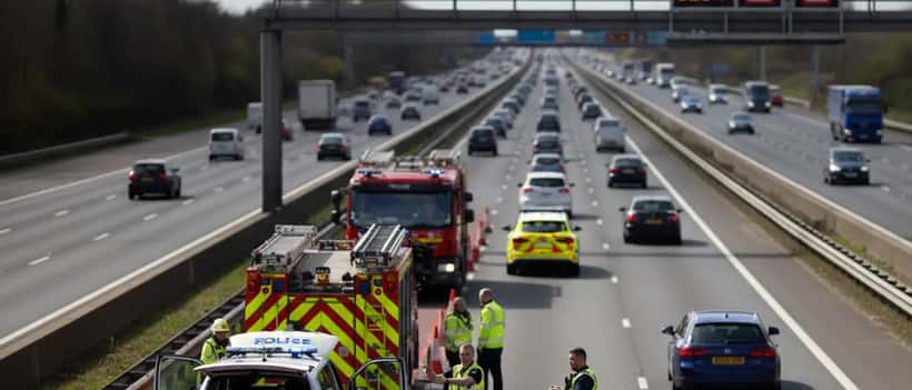 Police vehicles and emergency services attending to a road accident on a British motorway
