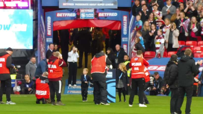 Rugby league Grand Final award ceremony, player receiving trophy on field at stadium