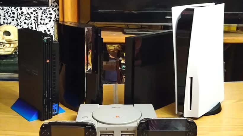 Collection of PlayStation consoles from PS1 to PS5 displayed together