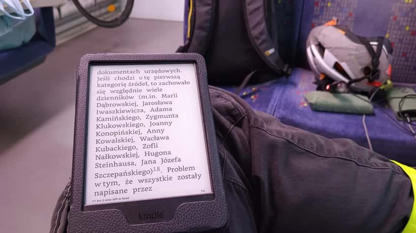 Amazon Kindle Paperwhite e-reader displaying a book page with crisp e-ink text