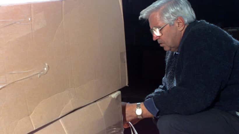 Canadian election official checks ballot boxes to ensure integrity at polling station