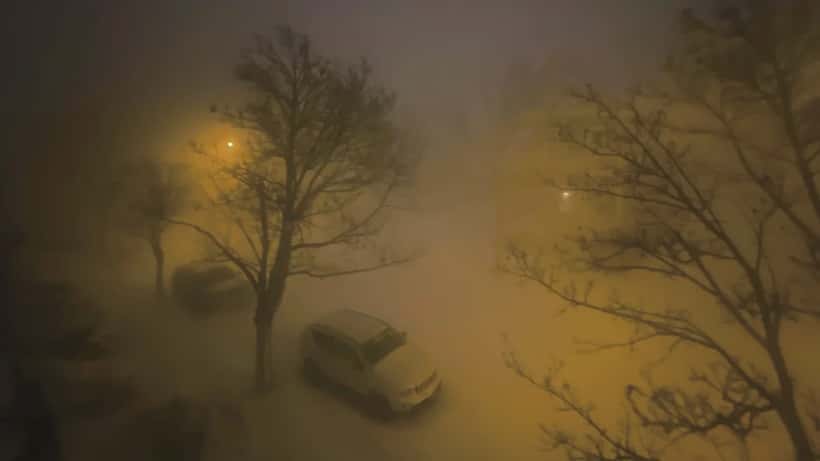 Residential street buried under heavy snow during a major North American blizzard