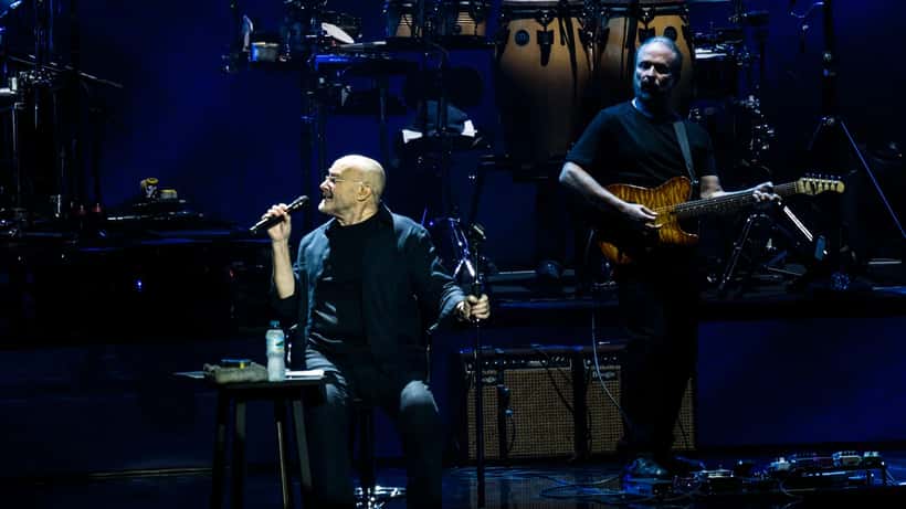 Phil Collins performing on stage at the Royal Albert Hall in 2017