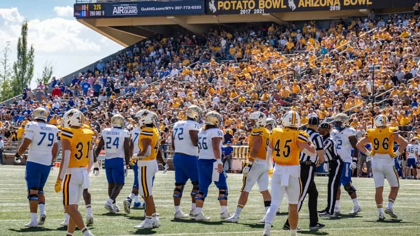 Wyoming Cowboys football game crowd at college stadium