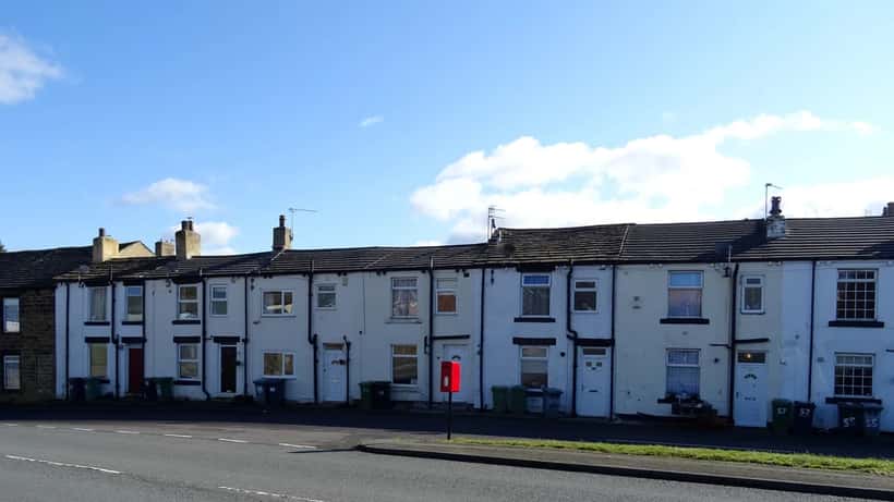 Leeds Road terraced houses in Howden Clough, Yorkshire — brick homes at risk of subsidence as summer rain returns