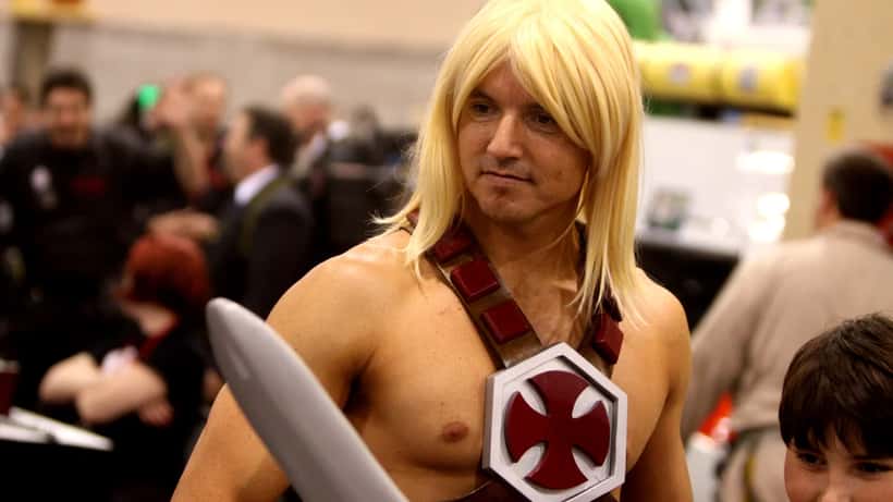 He-Man cosplay character at a fan convention representing the Masters of the Universe franchise