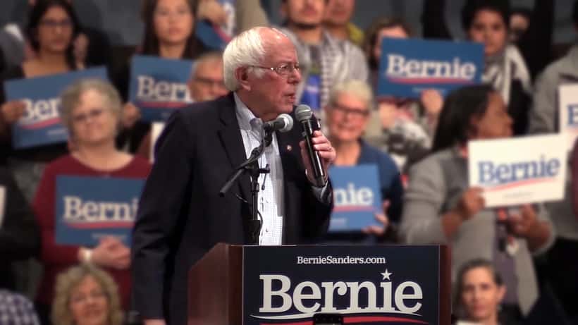 Bernie Sanders speaking at a rally addressing Social Security and retirement income protection legislation