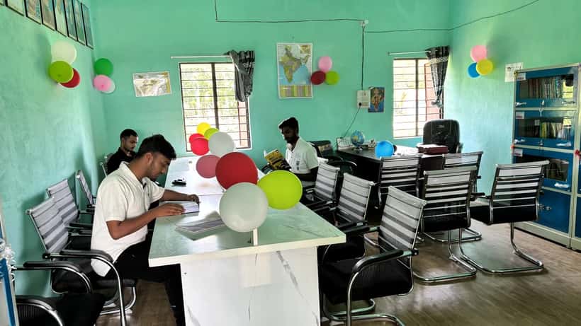 Students reading books in a public library