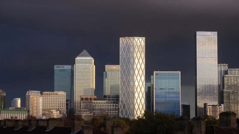 Canary Wharf London financial district skyline in 2025, representing UK wealth management and the billionaire exodus
