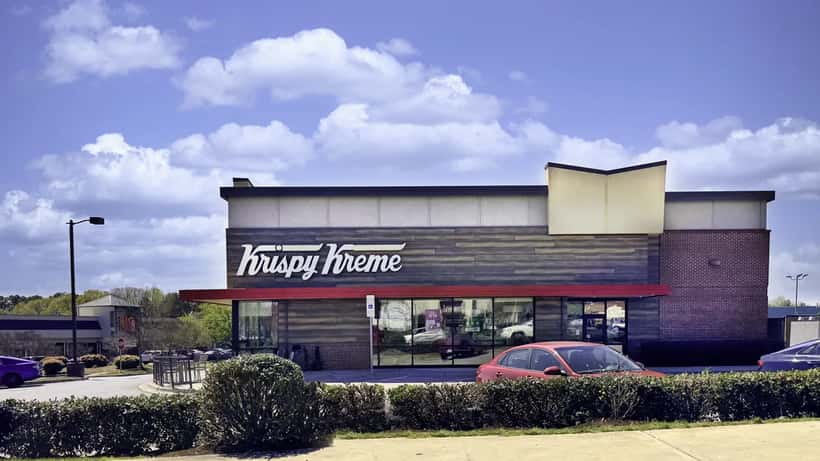 Modern Krispy Kreme cafe-style shop exterior with brand signage