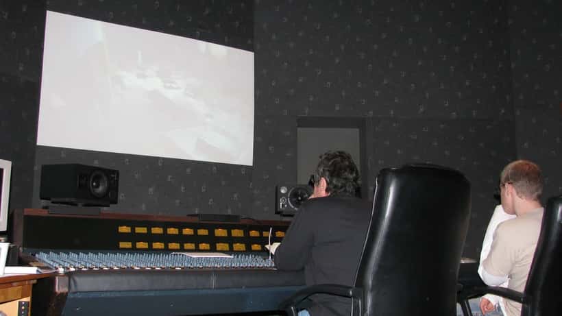 Recording studio control room with mixing desk and audio equipment