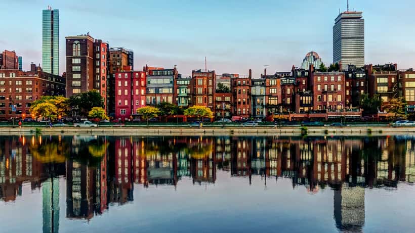 Boston Back Bay skyline reflected in water on a warm summer day