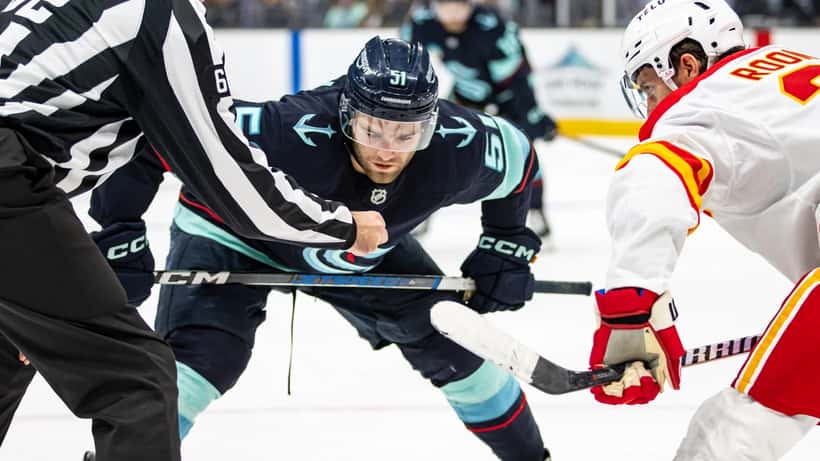 Shane Wright at a face-off during a Seattle Kraken game, September 2024