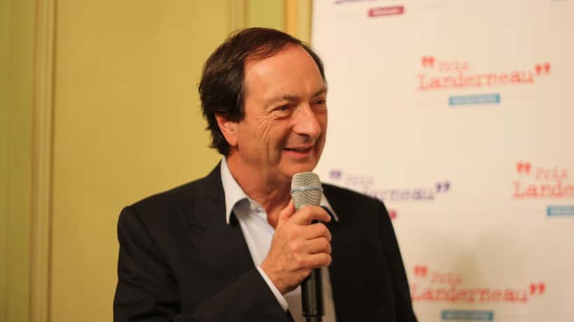 Michel-Édouard Leclerc lors d'une cérémonie, dirigeant d'E.Leclerc