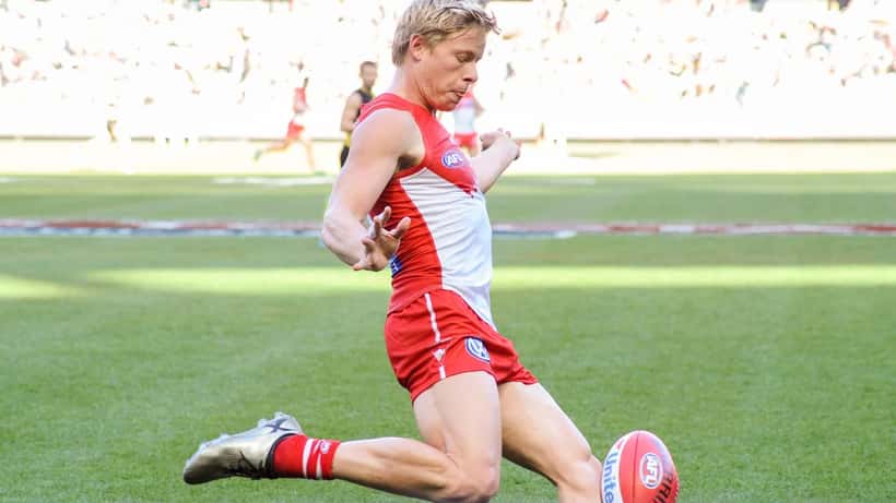 Isaac Heeney kicking during an AFL game — Sydney Swans 2026 suspension scandal