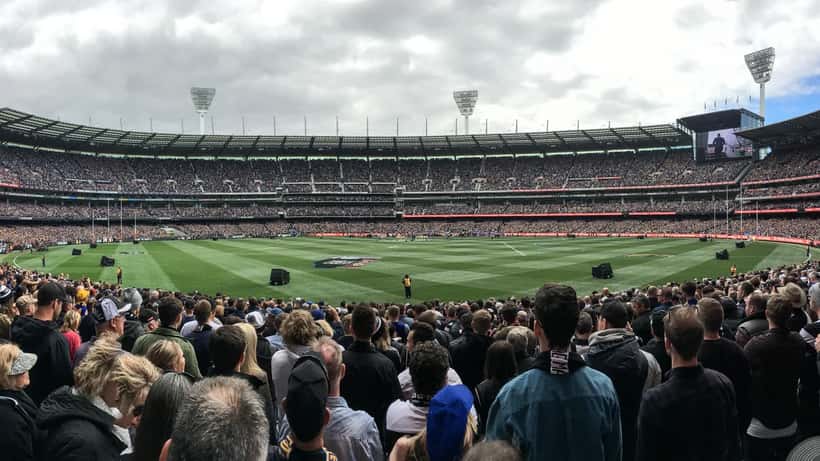 2018 AFL Grand Final panorama at the MCG with packed stands and players on the field