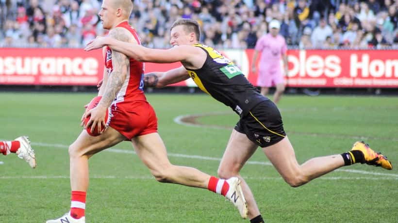 AFL players in a tackle during Geelong vs Sydney Round 11 at GMHBA Stadium 2026