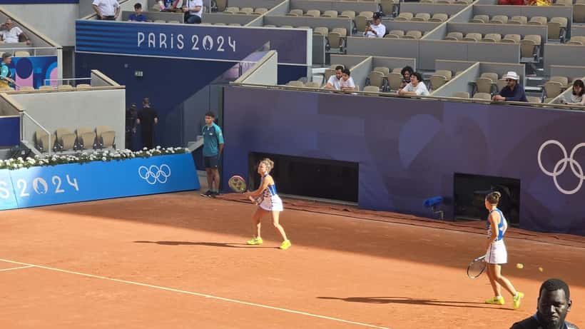 Mirra Andreeva and Diana Shnaider during a tennis match at the 2024 Summer Olympics